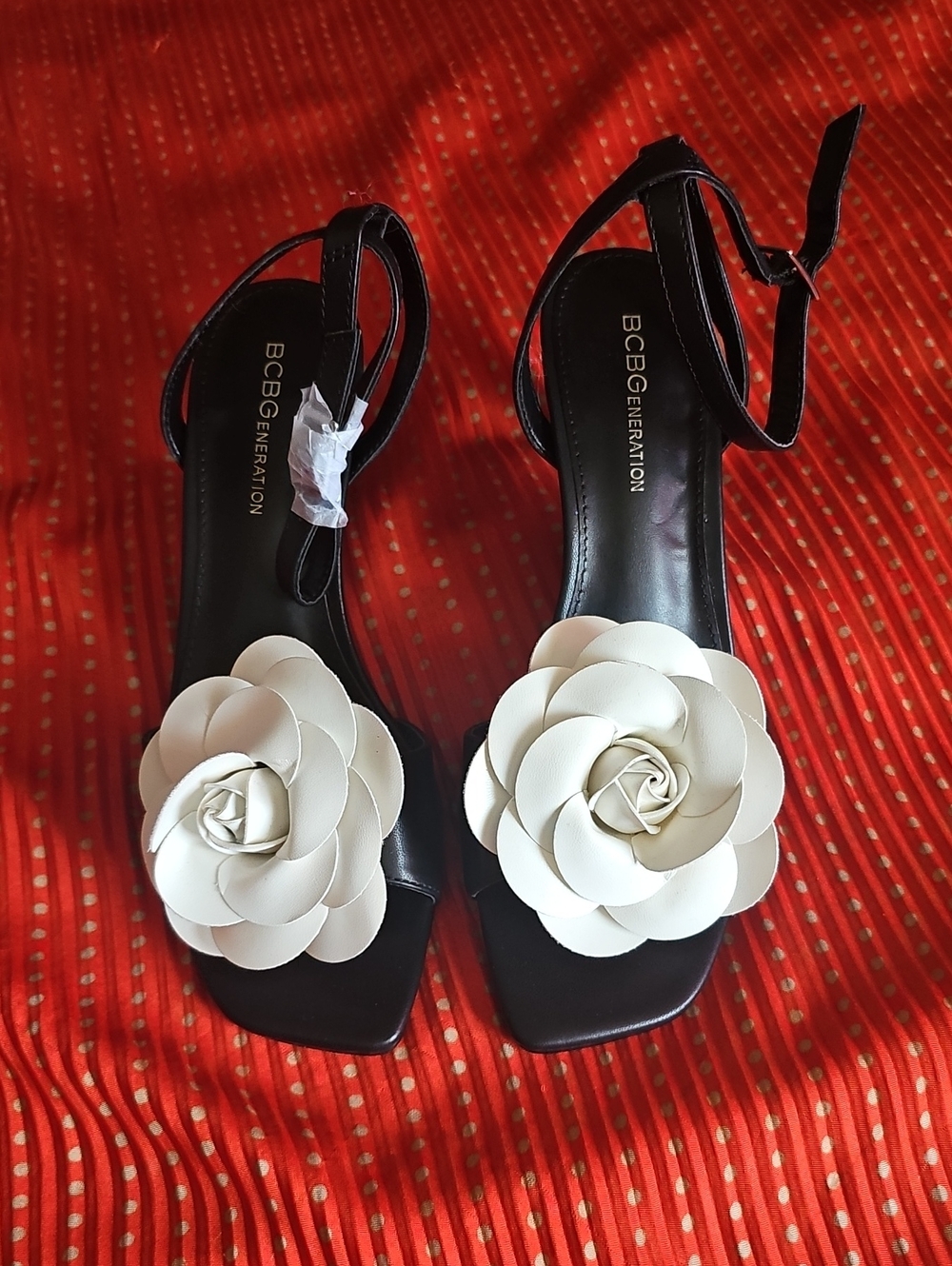 BCBGeneration Black Ankle-Strap Sandals with Cream Floral Appliques